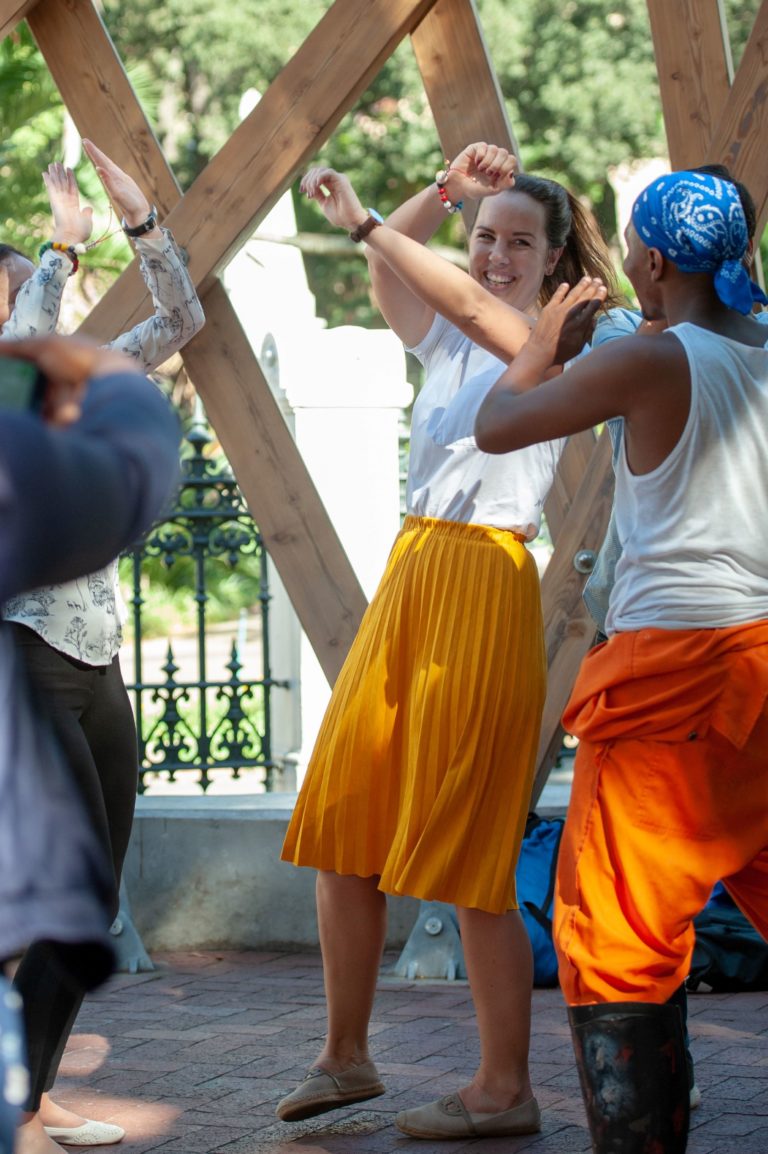 A lady dancing with colleagues in Cape town