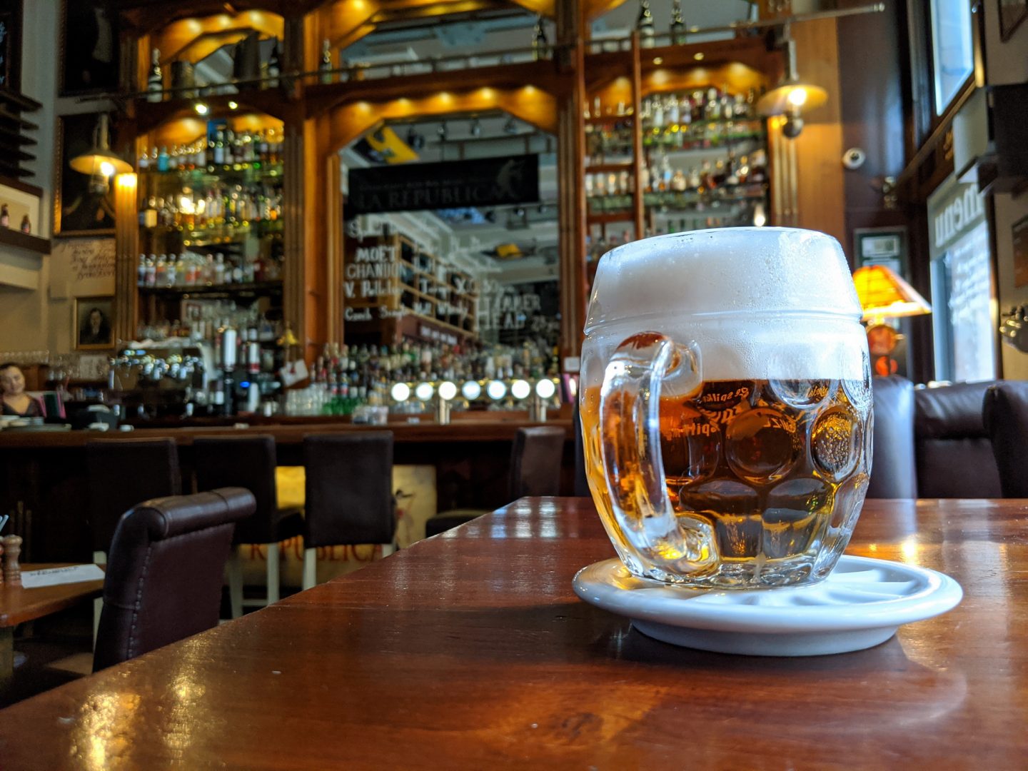 A glass of beer in authentic atmosphere somewhere in Prague in the Czech Republic