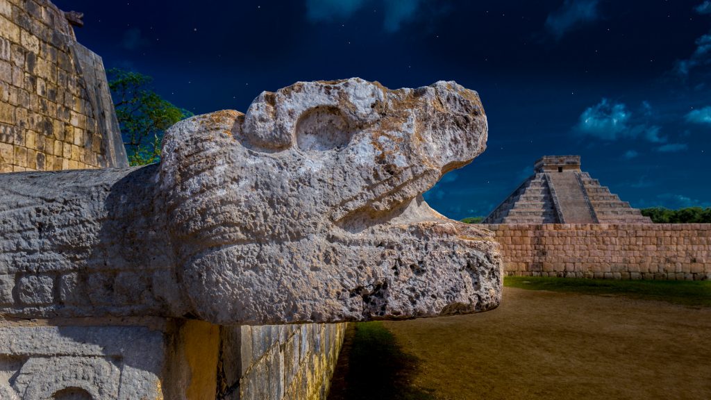 A view of the Mayan ruins of Chichen Itza in Mexico at night.