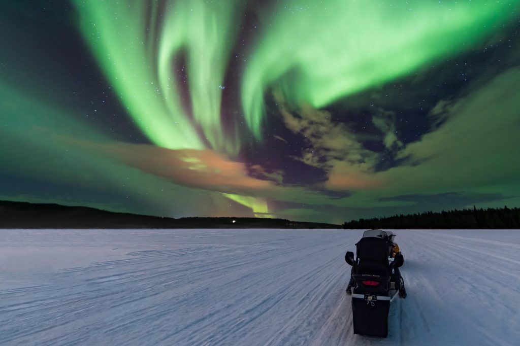 Chase the Aurora Borealis by snowmobile in Lapland