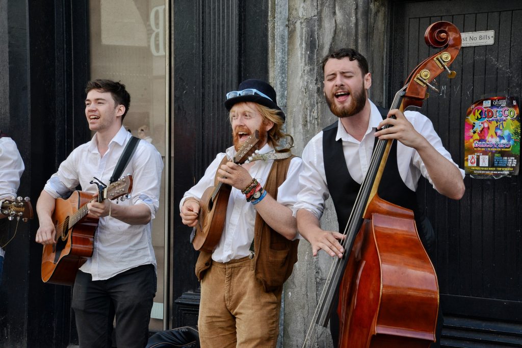 Buskers performing music on the streets of Galway in Ireland