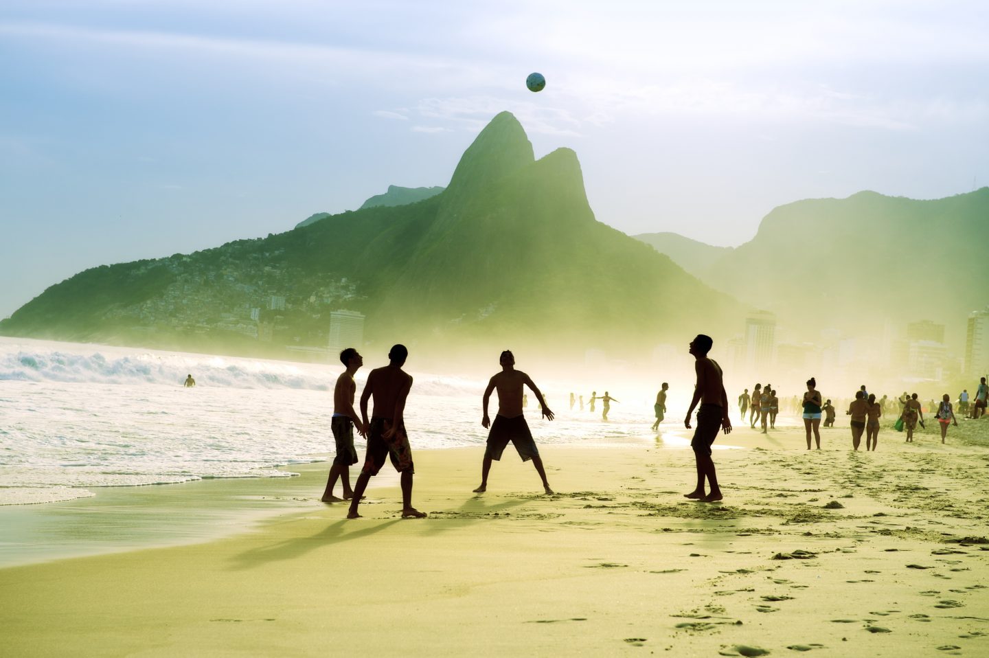 Catch the locals playing football at the beaches of Rio de Janeiro