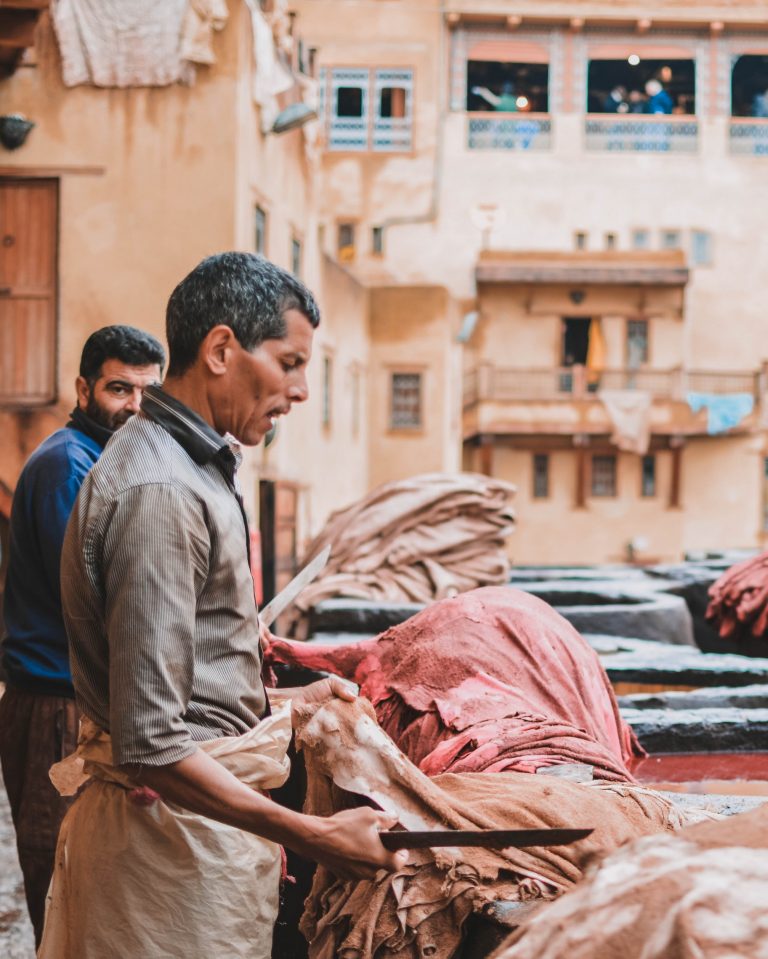 Man processing leather in Fez, Morocco.