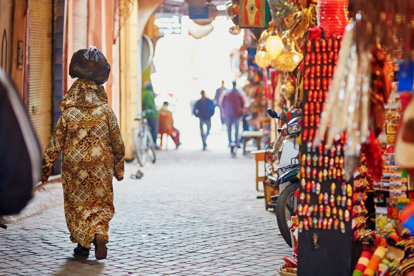 Woman walking down the souk in Fez, Morocco.