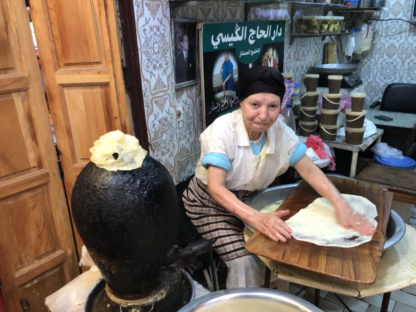 A woman making fresh bread in Fez, Morocco.
