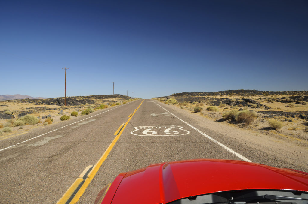 View from red car on famous Route 66 in Californian desert
