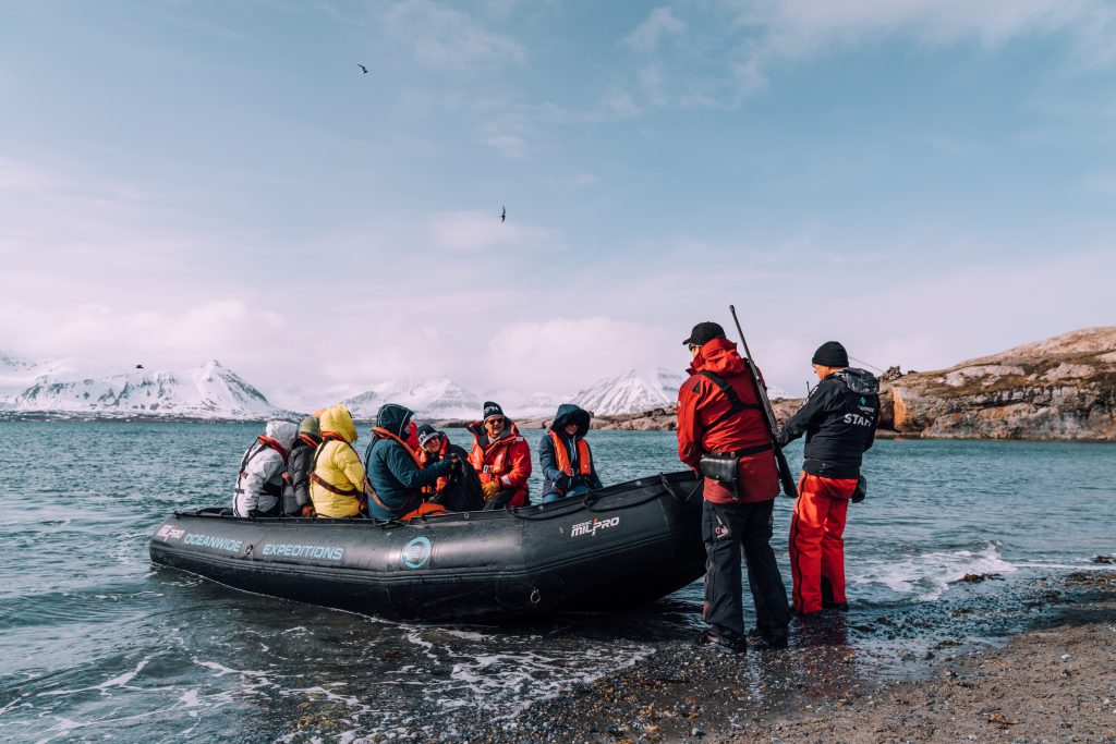 adventure expedition alight inflatable boat in spitsbergen island