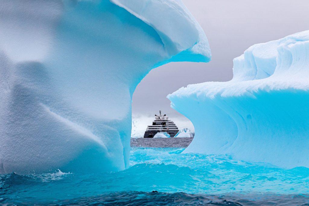 Expedition Voyage far North among views of iceberg