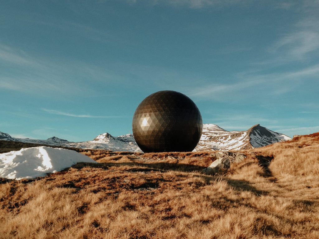sphere architecture surrounded by mountains