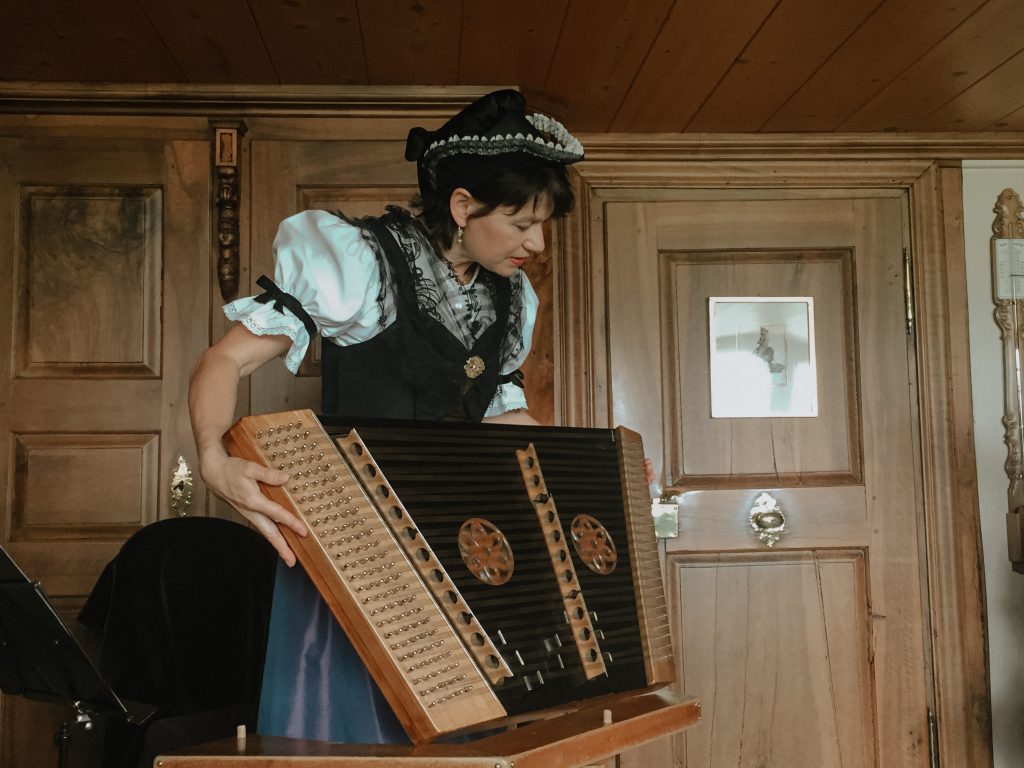 women playing musical instrument