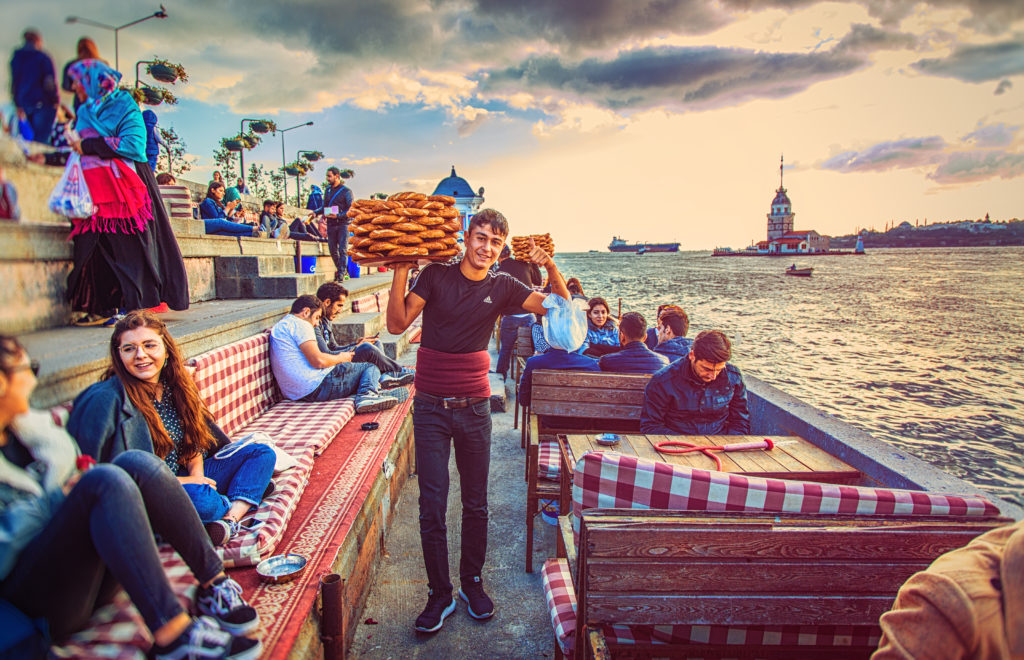 Enjoy a local Simit and Turkish tea on the Bosphorus