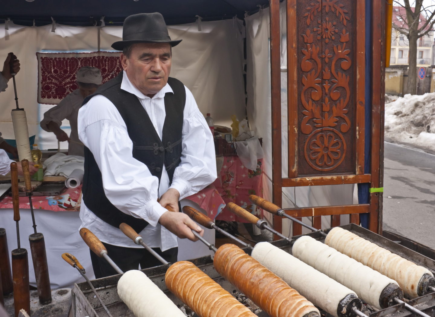Baker makes traditional Hungarian cakes at the Carnival of the Burial of Winters.