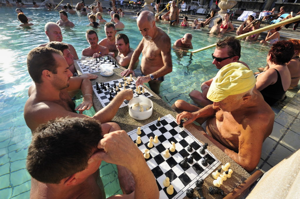 Men playing chess at the Geller Thermal Bath in Budgaest, Hungary.