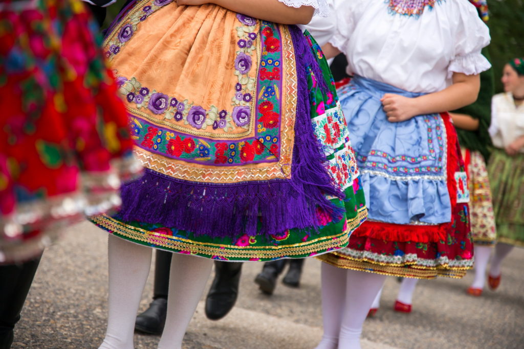 People dressed in traditional Hungarian folk costumes.