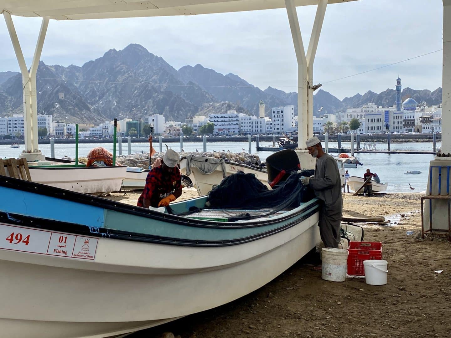 Experience the bustling activity of Muscat's fishing trade