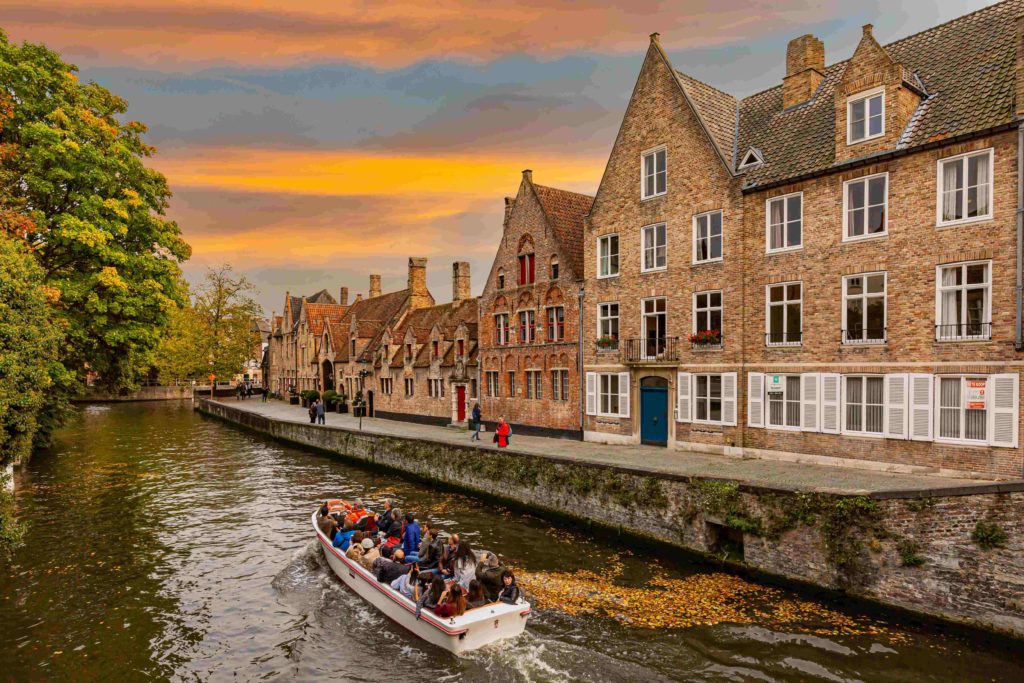 Enjoy an early morning boat ride on one of the many canals in Bruges, Belgium.