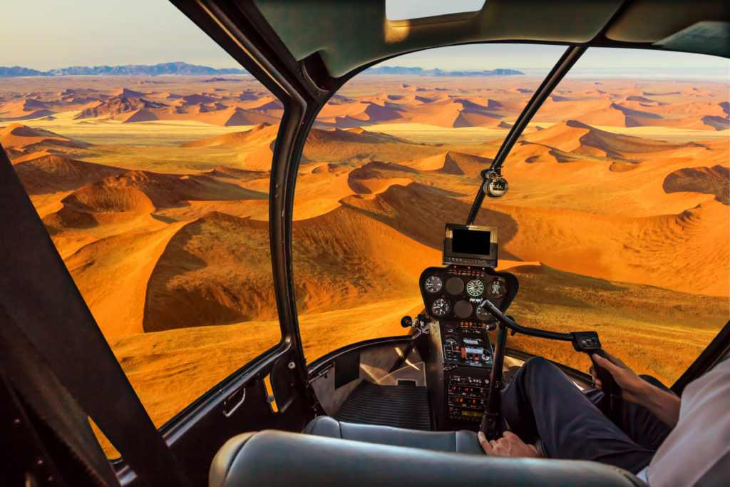 Take a scenic helicopter flight over the iconic dunes in Namibia