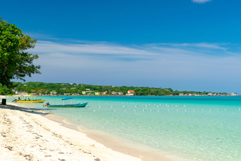 Experience the Jamaican vibe while lounging on a crisp sandy beach