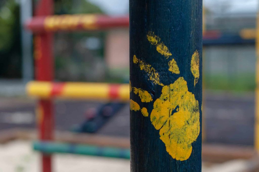 Children's playground yellow hand on pole