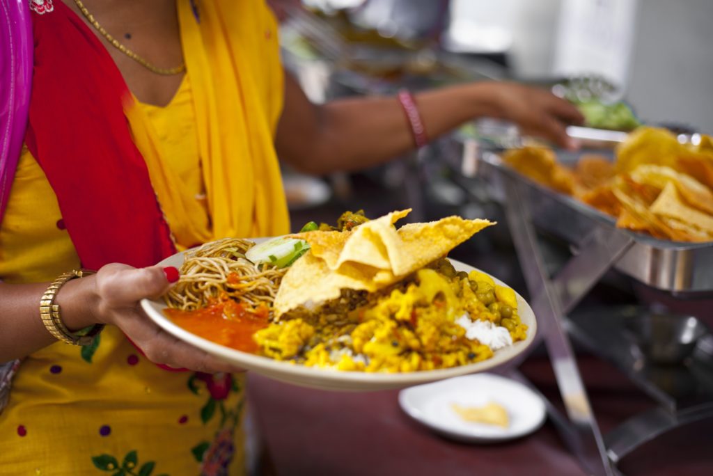 Savoring a plate of Dal Bhat, a traditional and flavorful Nepalese meal.