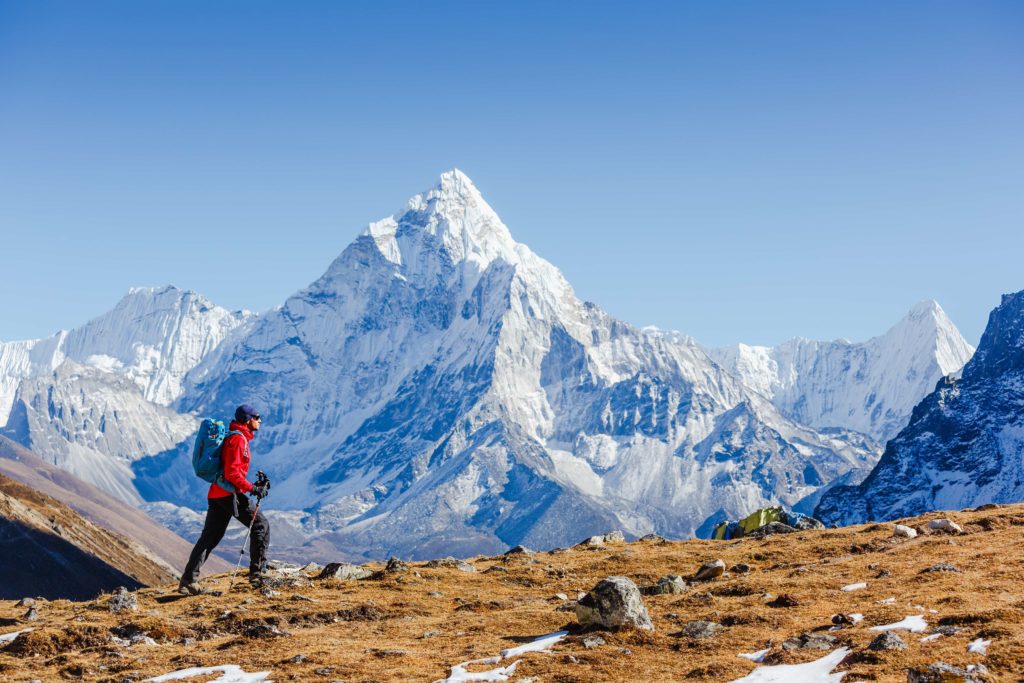 Adventurous man hiking Mount Everest in the Himalayas, Nepal.