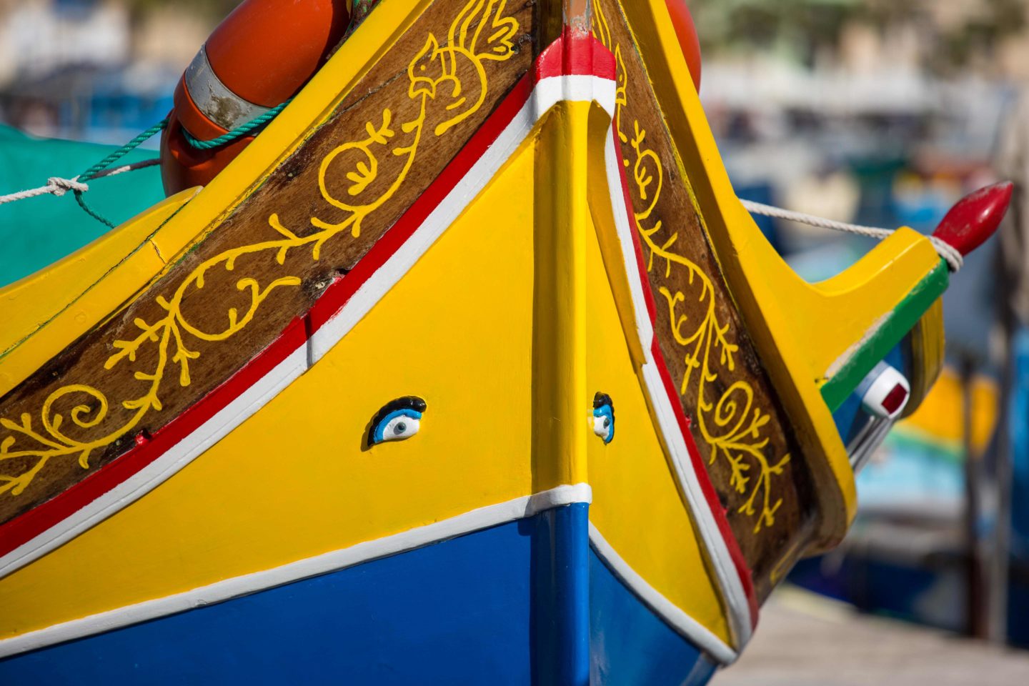 Colorful Maltese fishing boats located in Marsaxlokk harbor, Malta.