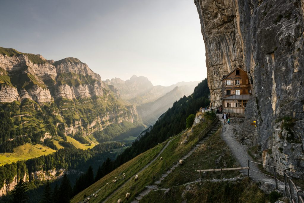 Scenic Swiss Alps and the Aescher Klippe mountain restaurant beneath Ebenalp, providing a picturesque view of the Appenzell region in Switzerland.