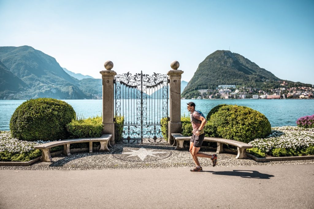 Extreme sportsman Filippo Rossi jogging through Parco Ciani in Lugano, passing the famous iron gate.