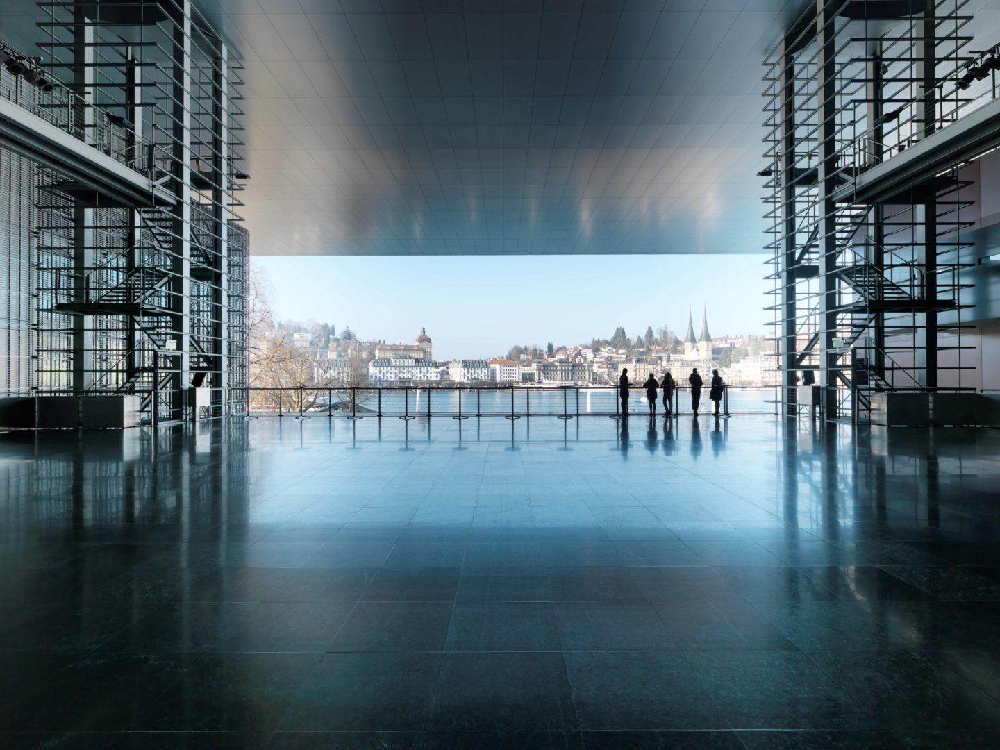 Interior of a bustling building with people standing around