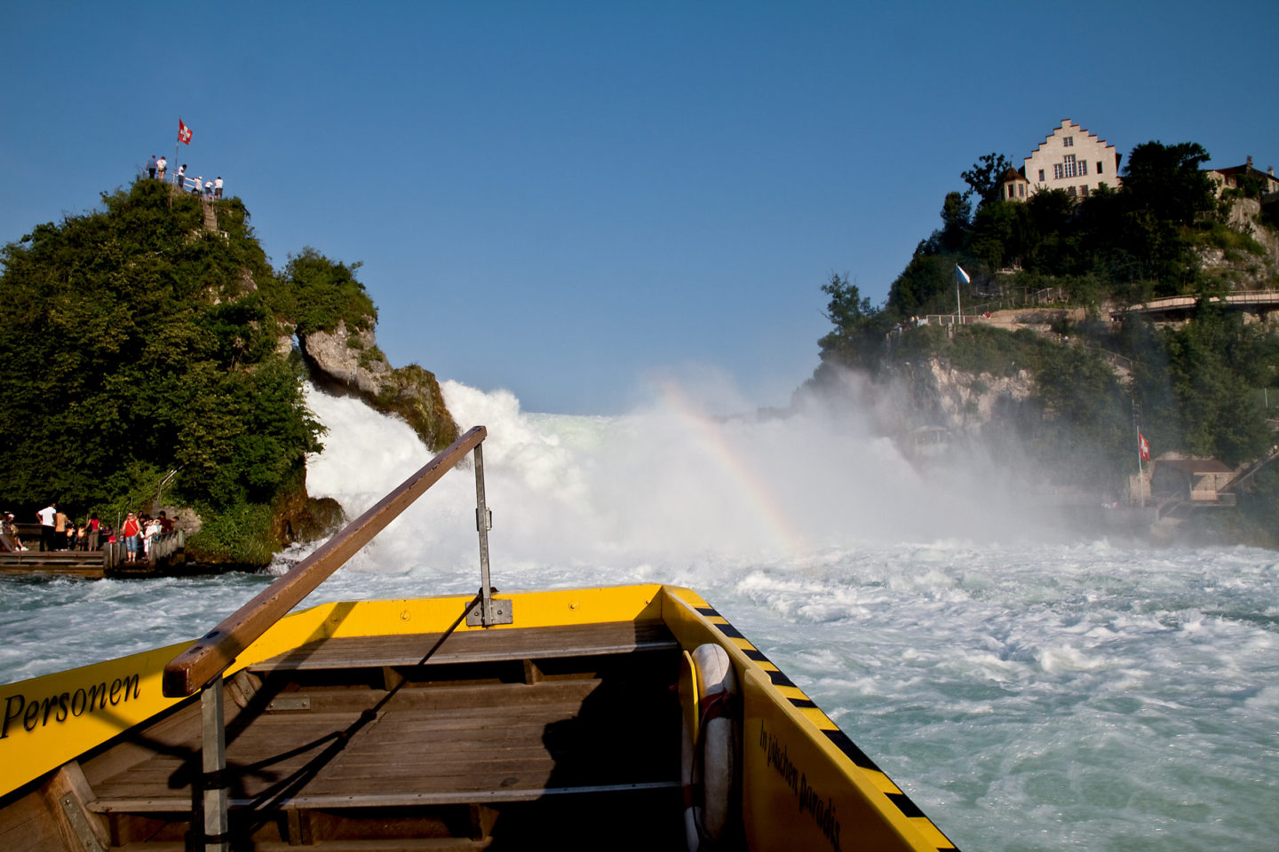 A tourist boat approaching the Rhine waterfalls at Schaffhausen on Switzerland