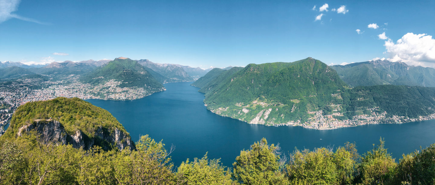 View of the Lake surrounded by mountains in the summer