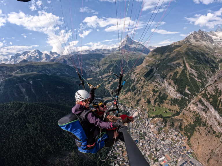 Enjoying the thrill of paragliding over mountain range