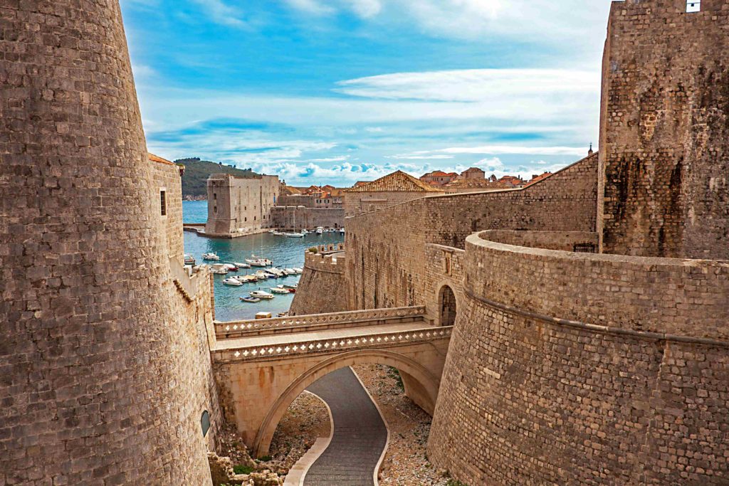 View through the ruins in the old town to the port of Dubrovnik, Croatia.