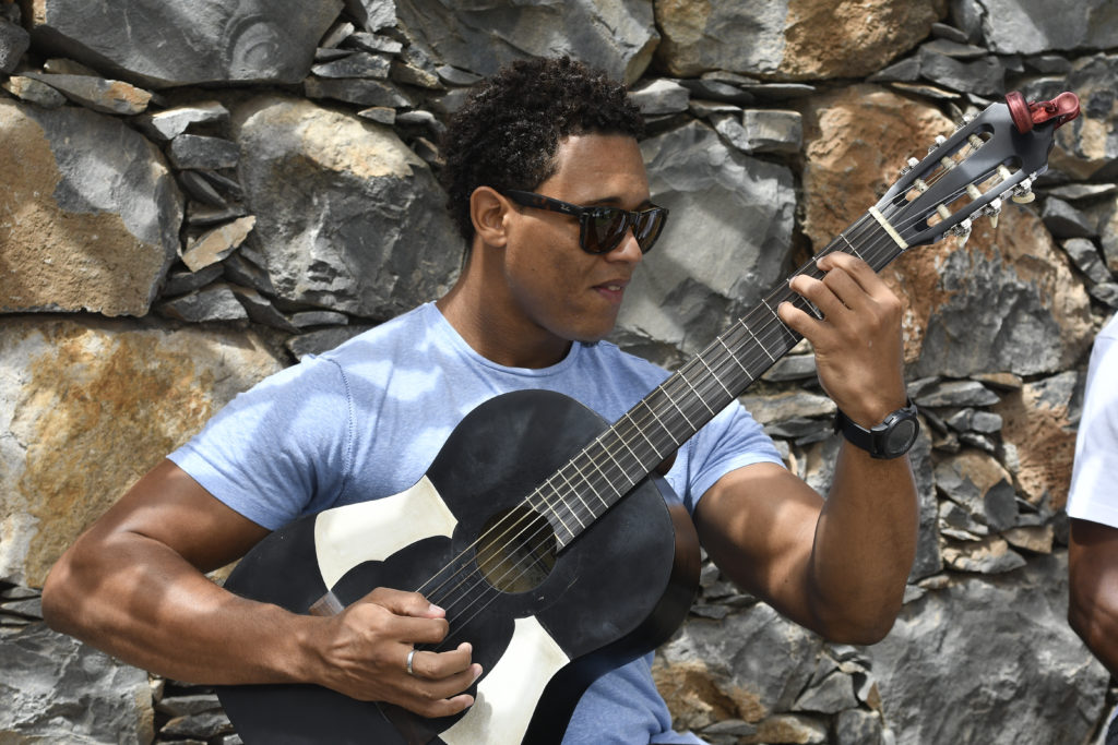 A man plays the guitar during an event in Cape Verde.