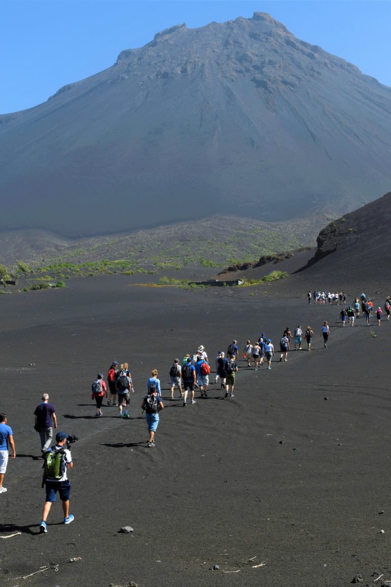 A group of people hike up to the volcano of Fogo in Cape Verde.