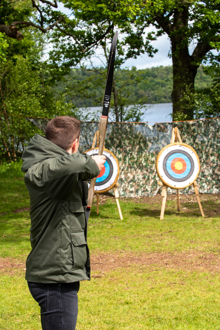 A man aims at the archery target during the Highland Games at an event in Scotland.