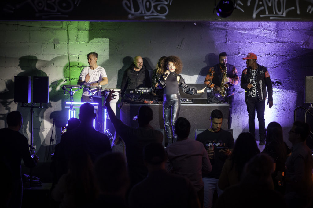 A band plays in front of a group of people during an event in Berlin.