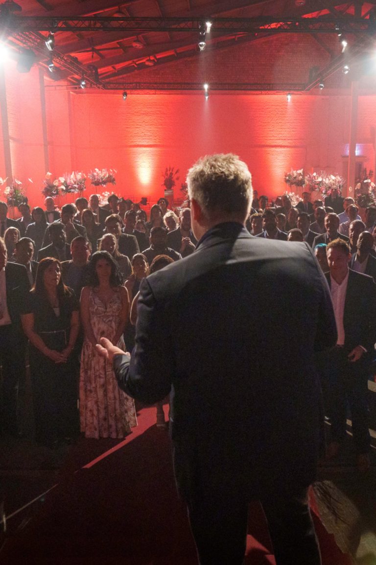 The boss of a company speaks to the employees at an event in Berlin.