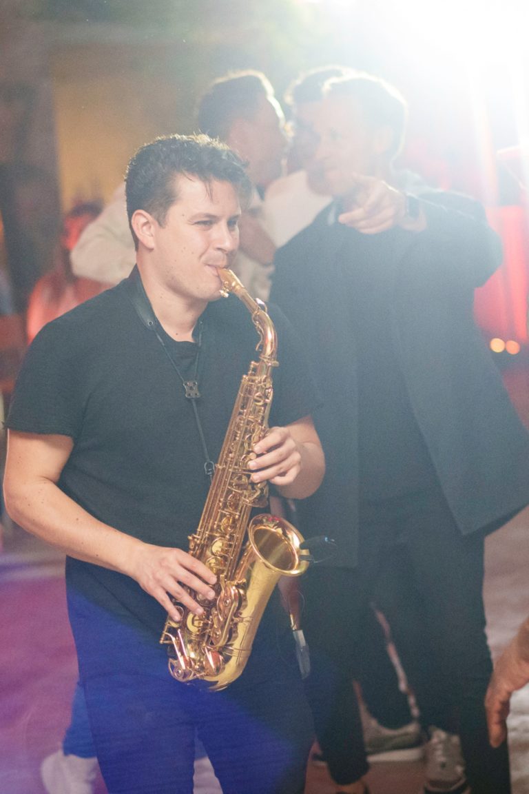 A man entertains guests with his saxophone during an event in Berlin.