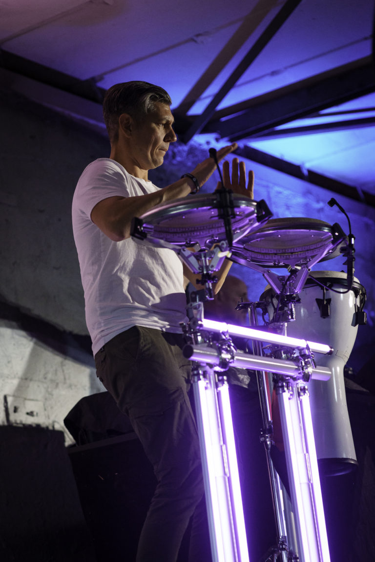 A musician plays drums during an event in Berlin.