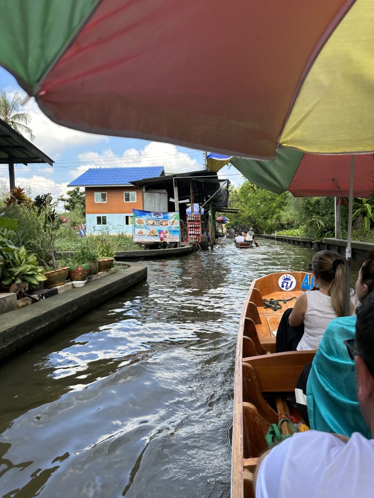 A longtail boat cruises along waterways in Bangkok.