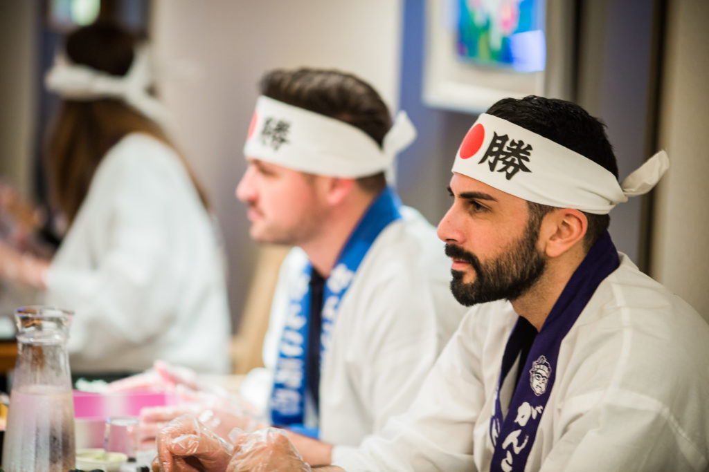 The participants listen intently to the Sushi master class.