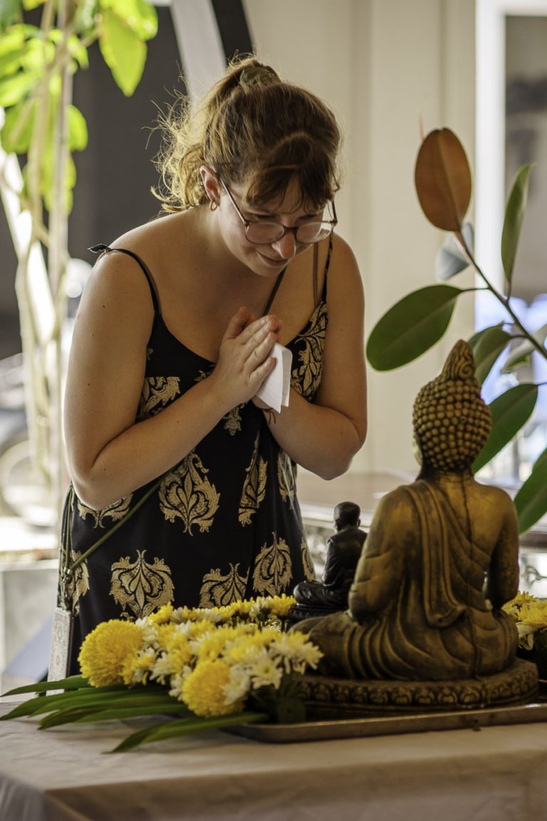 Hannah from the events team prays for a successful CSR day in Phuket, Thailand.