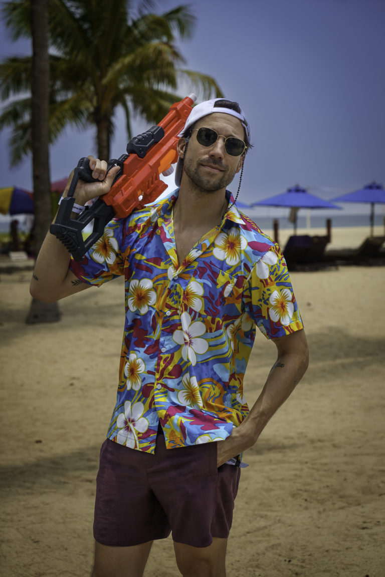 Jonas from the events team holds a water gun for the water fight during Songkran in Phuket, Thailand.