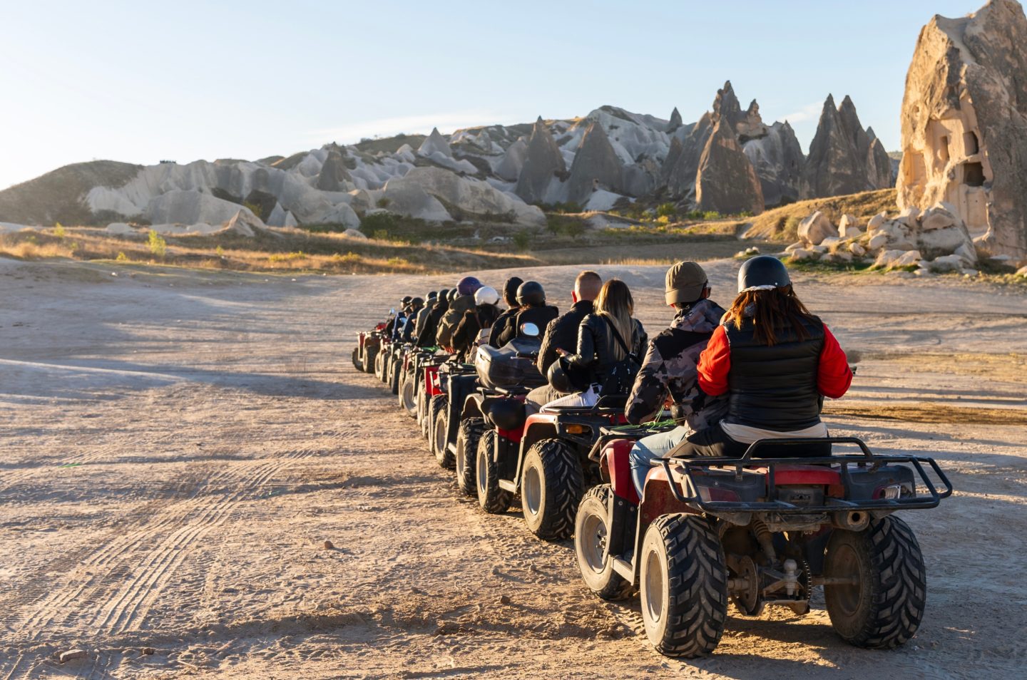 A group of people taking an ATV tour around the desert