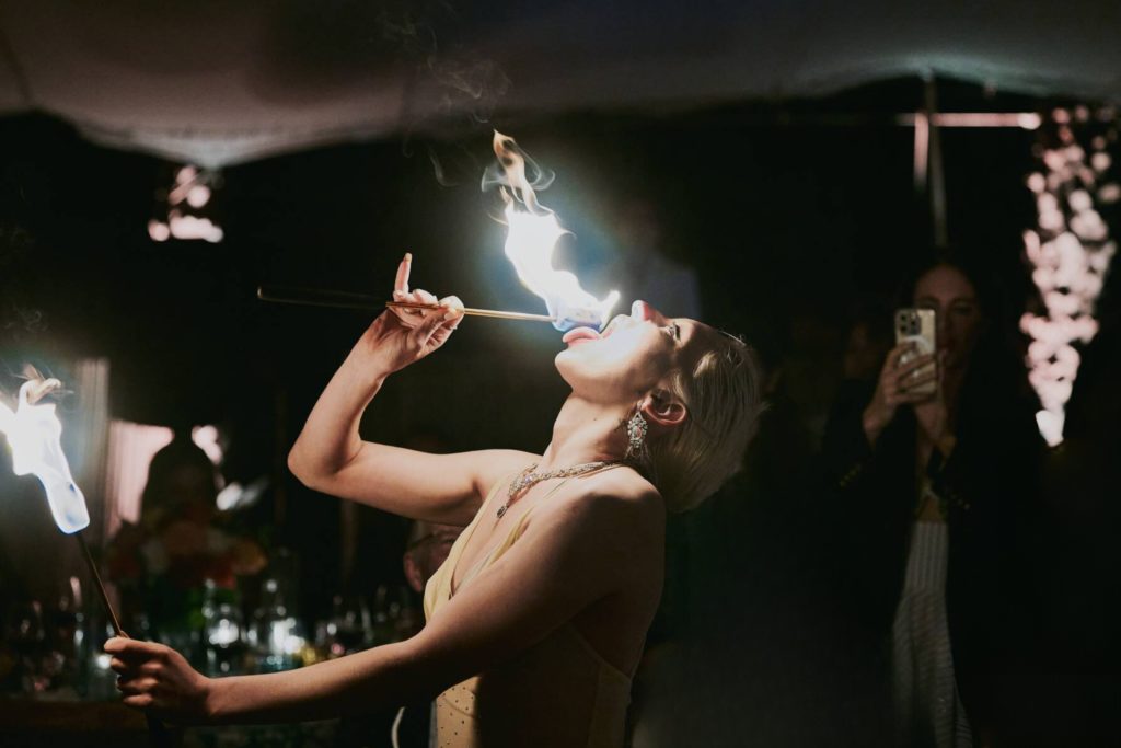 A fire eater delights guests during a private event in Puglia, Italy.