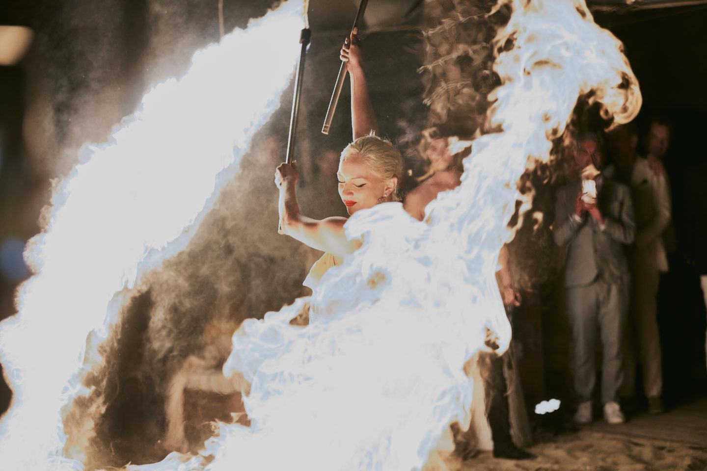 A woman wields fire during a fire show at an event in Puglia, Italy.