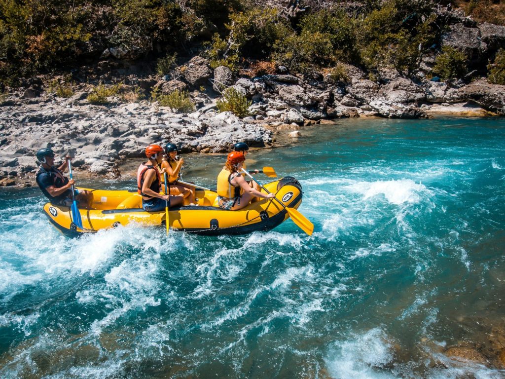 People enjoying whitewater rafting in Osumi Canyon, known for its waterfalls and thrilling river gorge experience.