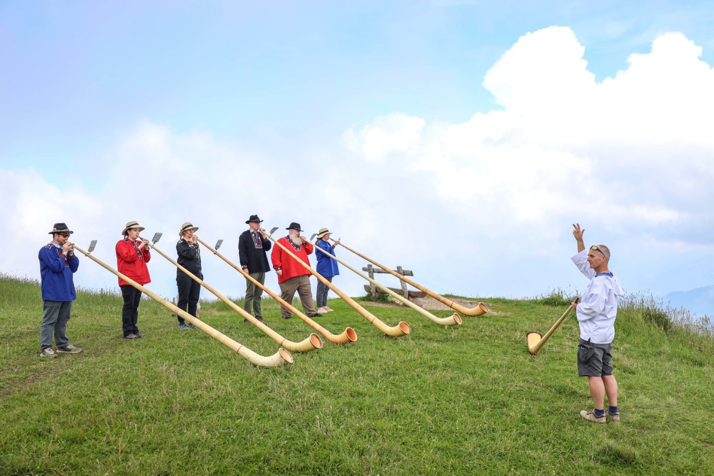 A group of people in an alphorn workshop on mount Rigi in Switzerland