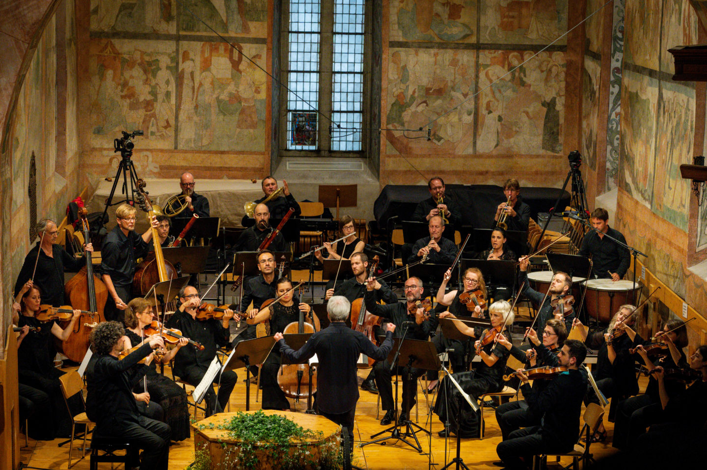 Classical concert at the Menuhin festivals showcasing the Kammerorchester Basel performing in a church in Gstaad Switzerland